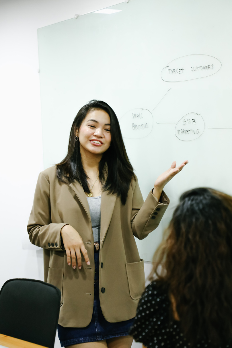 Woman presenting in a meeting